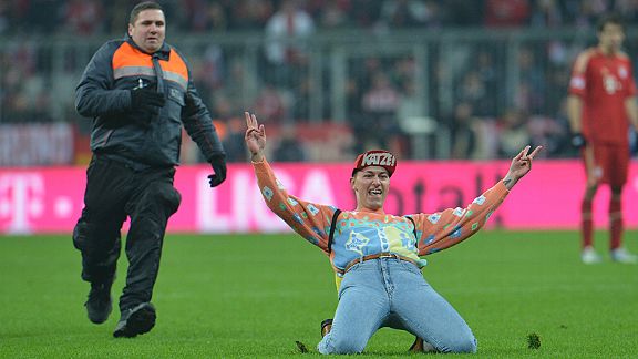A fan gets a little over-exciting during the crucial Dortmund versus Bayern Bundesliga clash