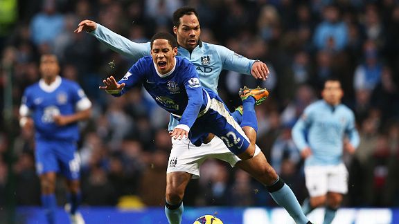 Joleon Lescott sends Steven Pienaar flying through the air