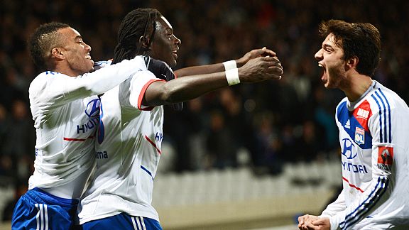 Lyon celebrate after Bafetimbi Gomis scored what proved to be Lyon's winner at home to Montpellier