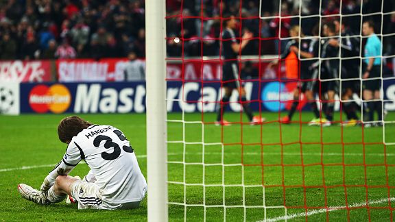 BATE goalkeeper Andrey Gorbunov is crestfallen after Thomas Muller scored Bayern's second goal