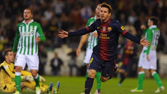 Lionel Messi celebrates after netting the opening goal at Real Betis, equalling Gerd Muller's record of 85 goals in a calendar year