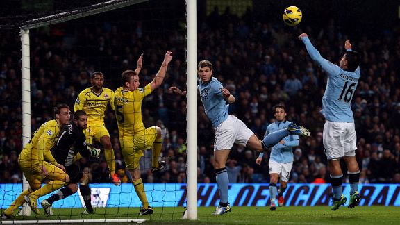 Edin Dzeko and Sergio Aguero attempt to make a connection as Manchester City battle to break down Reading