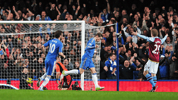 Fernando Torres celebrates after heading Chelsea into an early lead against Aston Villa.