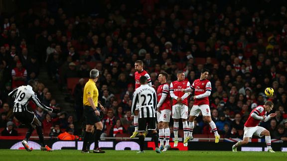 Demba Ba's free-kick takes a deflection from Jack Wilshere to level the scores at 1-1