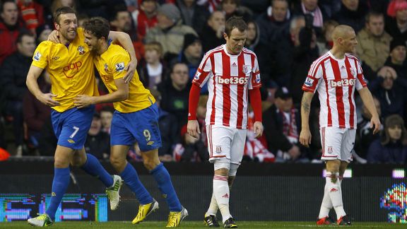 Southampton's Rickie Lambert and Jay Rodriguez celebrate taking a 3-1 lead at Stoke through Andy Wilkinson's own goal
