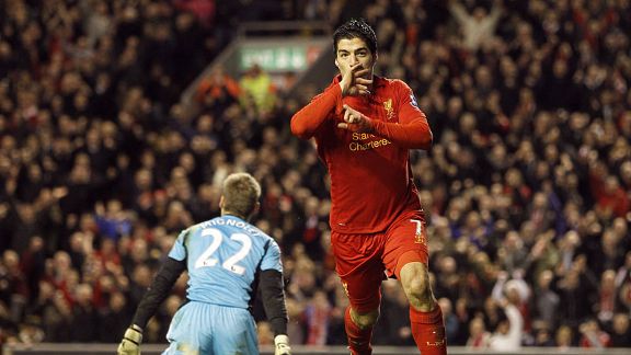 Luis Suarez celebrates his second goal and Liverpool's third against Sunderland