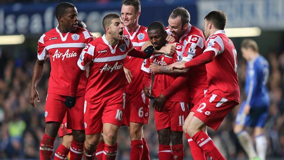 QPR players celebrate after taking the lead against Chelsea