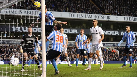 Coventry's Carl Baker tries in vain to prevent Clint Dempsey's header putting Tottenham 3-0 up