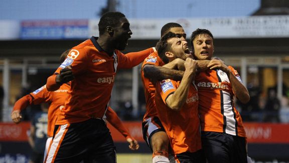 Luton celebrate after taking the lead against Wolves through Alex Lawless