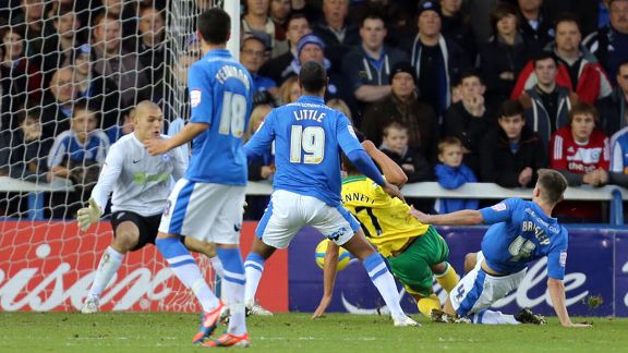 Elliott Bennett nets the opener for Norwich against Peterborough