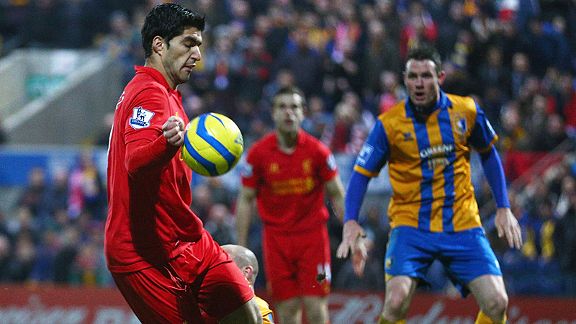 Luis Suarez controls the ball with his hand before scoring what proved to be Liverpool's winner at Mansfield