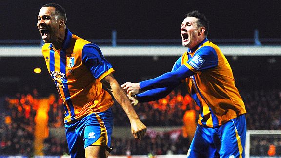 Lee Beevers celebrates with goalscorer Matthew Green after Mansfield grabbed their consolation against Liverpool
