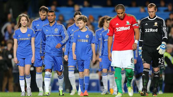 Chelsea captain Ashley Cole leads his team out for the clash with Swansea