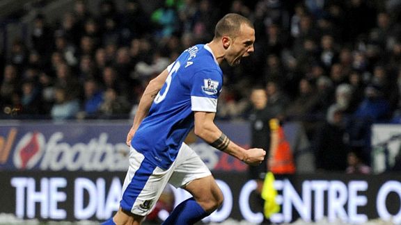 Johnny Heitinga celebrates his late winner against Bolton