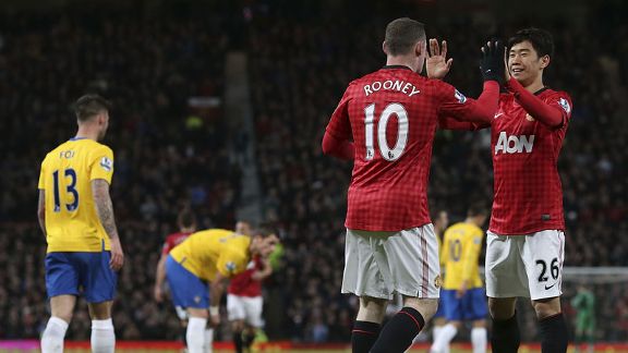 Wayne Rooney celebrates with Shinji Kagawa after netting the equaliser against Southampton