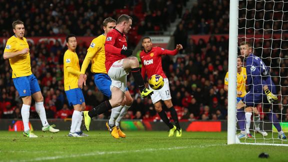 Wayne Rooney turns home his second goal of the night to put Manchester United 2-1 up