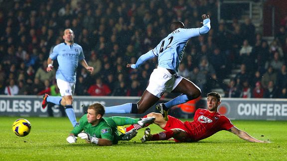 Manchester City goalkeeper Joe Hart makes a save but Jason Puncheon was on hand to score the rebound