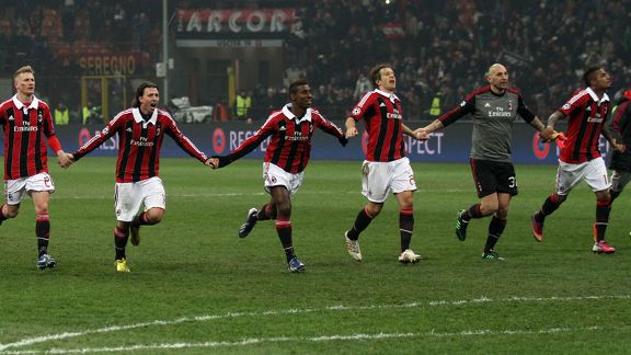 AC Milan players celebrate as a team following their 2-0 victory against Barcelona in the Champions League