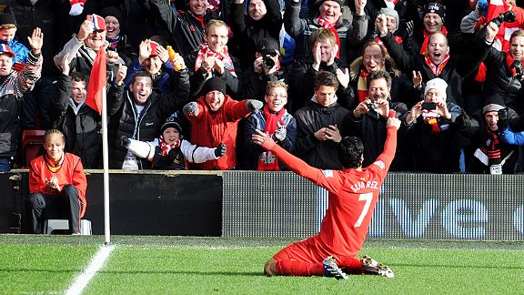 Luis Suarez celebrates after his first time finish have Liverpool the lead at home to Spurs 