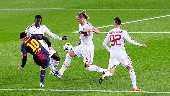 Lionel Messi avoids the attention of three Milan defenders to superbly fire Barcelona into the lead