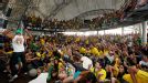 Brazilian supporters in Rio de Janeiro watch their team defeat Chile in the World Cup. 