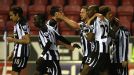 Newcastle celebrate after Shola Ameobi's opening goal against Wigan