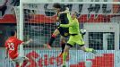 Axel Witsel beats Jurgen Macho to the ball to head Belgium into the lead in Austria.
