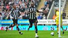 Shola Ameobi celebrates after opening the scoring from the penalty spot