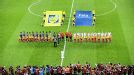 The teams hear their respective national anthems on the pitch in Frankfurt
