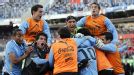 Uruguay celebrate after Diego Forlan's late goal made it 3-0