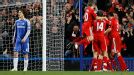 Liverpool celebrate their second goal while Chelsea's David Luiz stands dejected