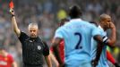 Chris Foy gives Vincent Kompany (r) his marching orders for a two-footed tackle on Nani.