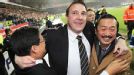 Cardiff boss Malky Mackay (c) celebrates with owner Tan Sri Vincent Tan Chee Yioun (r) and chairman Chan Tien Ghee (l).