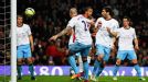 Theo Walcott is oblivious as the ball hits him and goes into the back of the net for Arsenal's leveller.