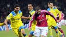 Lyon forward Lisandro Lopez struggles to find space against APOEL Nicosia