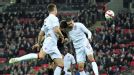 Klaas-Jan Huntelaar collides with Chris Smalling as he heads Netherlands' second goal