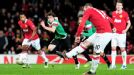 Wayne Rooney scores from the spot to give United hope.