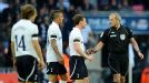 Tottenham protest to referee Martin Atkinson following the award of a goal for Juan Mata