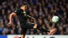Alexis Sanchez lobs the ball over Petr Cech only to see if bounce back off the bar