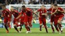 Bayern Munich celebrate after Bastian Schweinsteiger fired home the winning spot-kick.