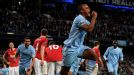 Vincent Kompany celebrates after heading City into the lead
