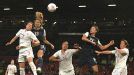 All-American hero: Alex Moran heads the winner for Team USA at Old Trafford