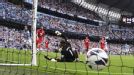 Carlos Tevez slots the ball past Kelvin Davis to give Man City the lead.
