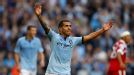 Carlos Tevez celebrates after wrapping up the scoring against QPR