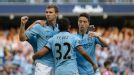 Edin Dzeko celebrates with his team-mates after putting Manchester City into a 2-1 lead