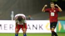 Rafael van der Vaart shows his frustration as Frankfurt's Bastian Oczipka celebrates victory