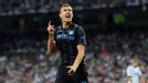 Edin Dzeko celebrates after firing Manchester City into the lead at the Bernabeu