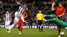 Gabriel Tamas scores past Liverpool goalkeeper Brad Jones