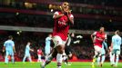 Arsenal's Theo Walcott celebrates scoring his side's sixth goal of the game
