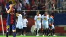 Lionel Messi hides his face as Sevilla race into a two goal lead against Barcelona